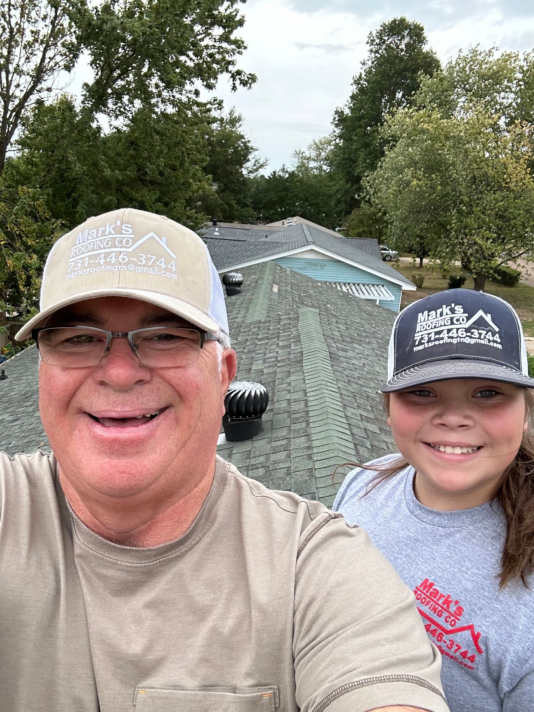 Worker Working On Roof — West TN — Mark’s Roofing Company Worker Working On Roof — West TN — Mark’s Roofing Company