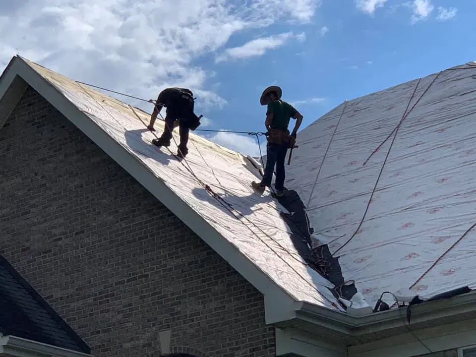 Workers Repairing Shingle Roof — West TN — Mark’s Roofing Company