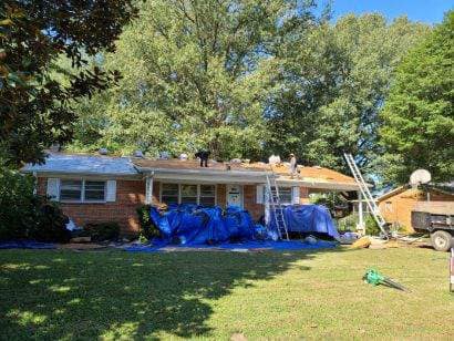 Blue Tarp In Front Of House — West TN — Mark’s Roofing Company