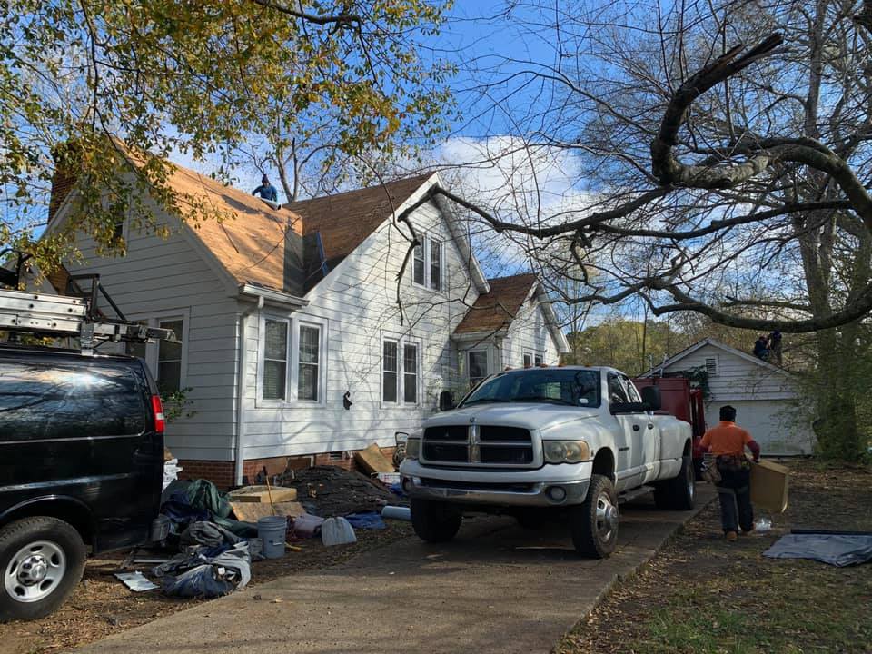 Pickup Truck Parked In Front Of House — West TN — Mark’s Roofing Company