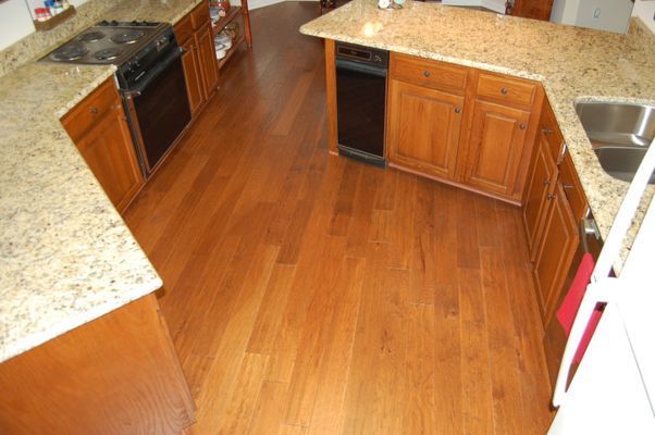 A kitchen with wooden cabinets and granite counter tops