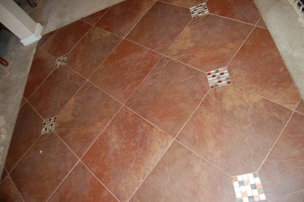 A close up of a tiled floor with squares on it