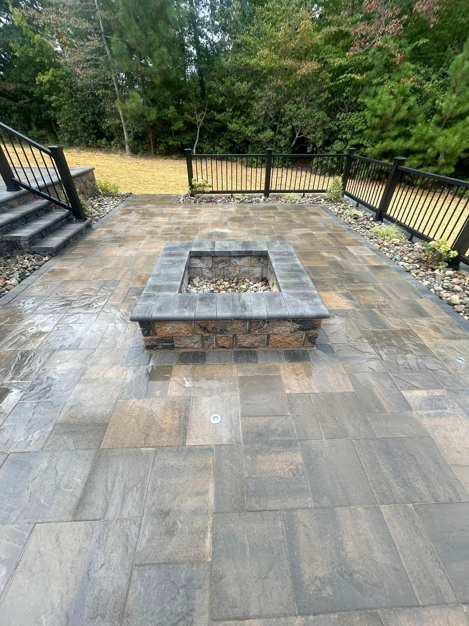 There is a fire pit in the middle of the patio.