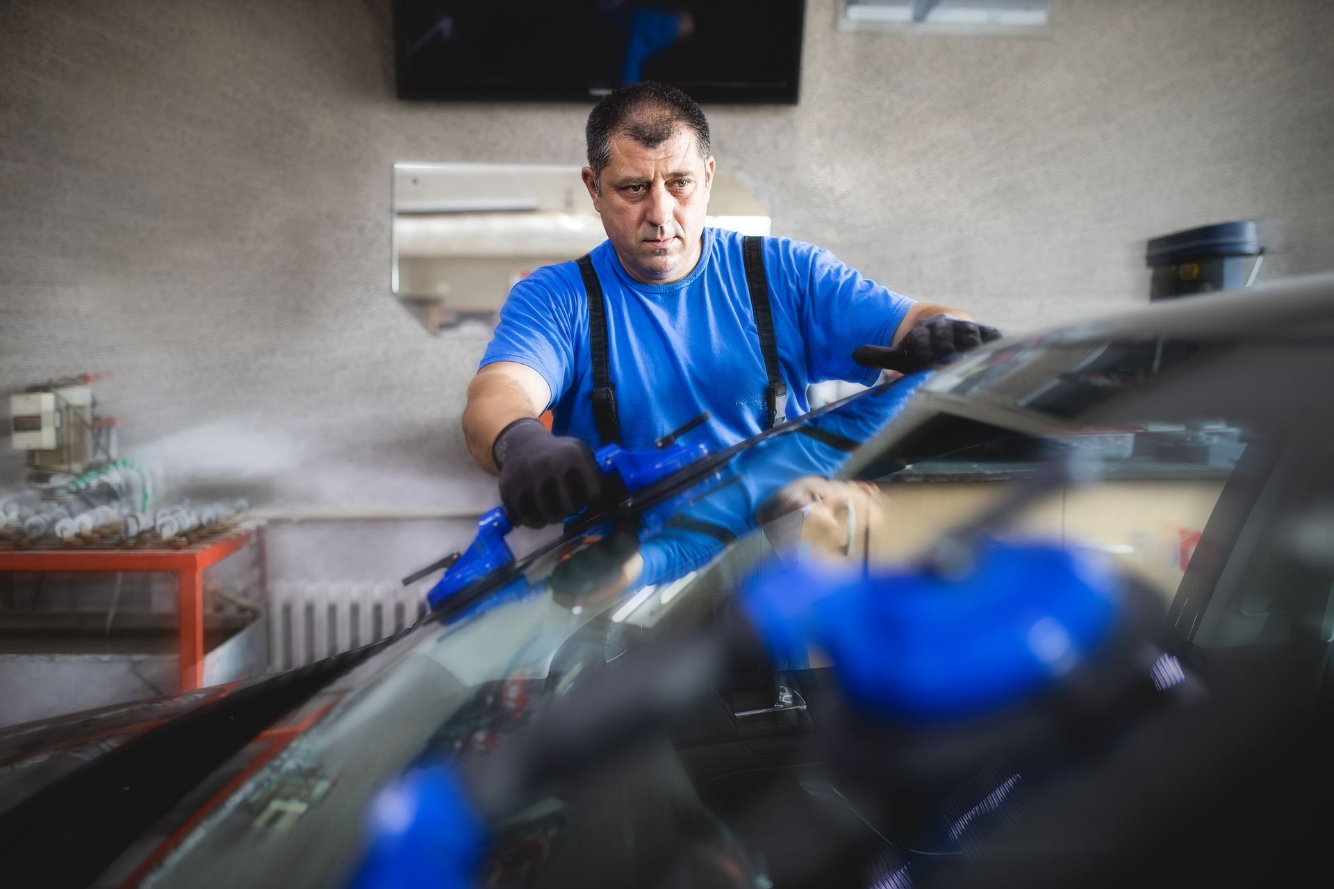 Worker Repairing Windshield — Virginia Beach — Low Price Auto Glass