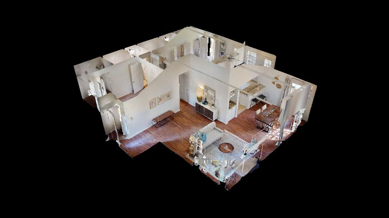 3D model of a home interior, featuring visible furniture, walls, and flooring; viewed from above.