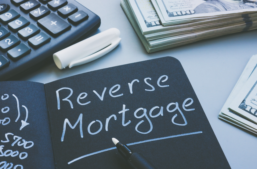 A chalkboard with the words reverse mortgage written on it