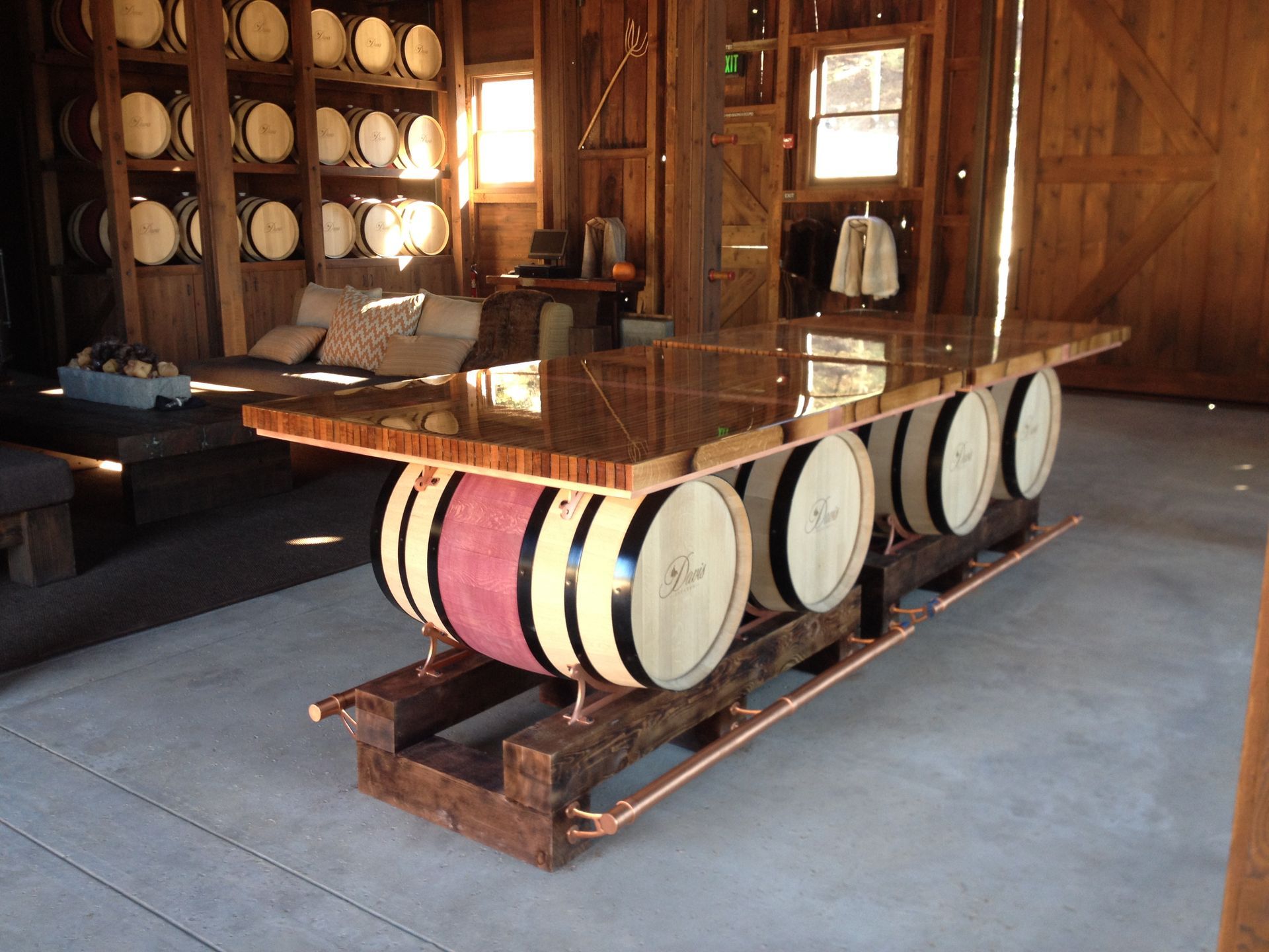 Built-in white media center with TV, fireplace, and shelves with wood backing; a person on screen.