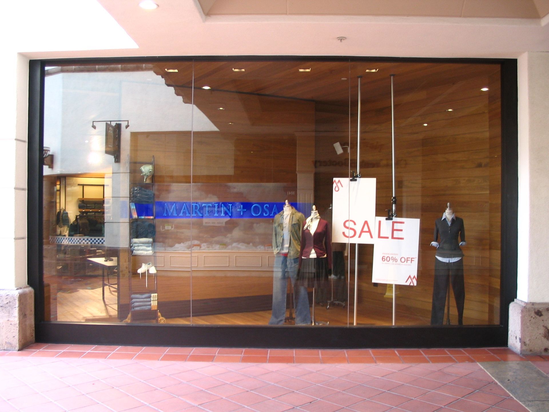 Storefront with mannequins wearing clothes, 