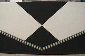 Geometric black and white design with yellow and gray accent lines.