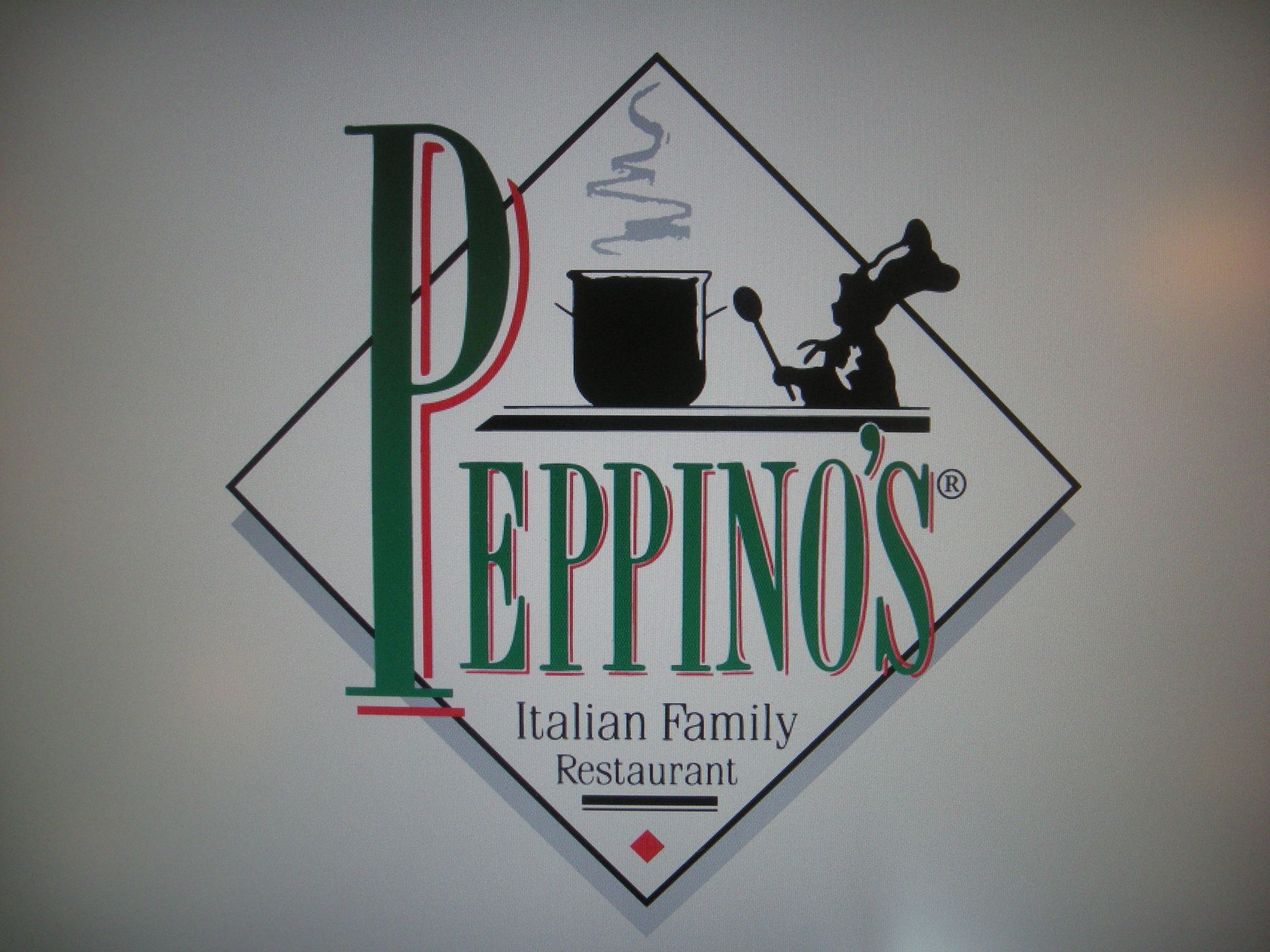 Logo for Peppino's Italian Family Restaurant. A diamond shape around the name, with a chef stirring a pot.