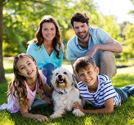Adoption — Happy Family with their Dog in Grand Forks, ND