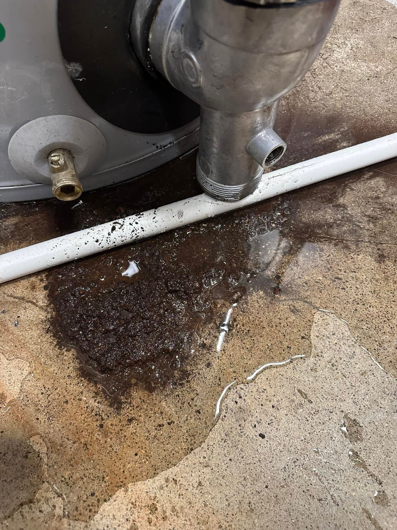 Water heater leaking onto concrete floor.