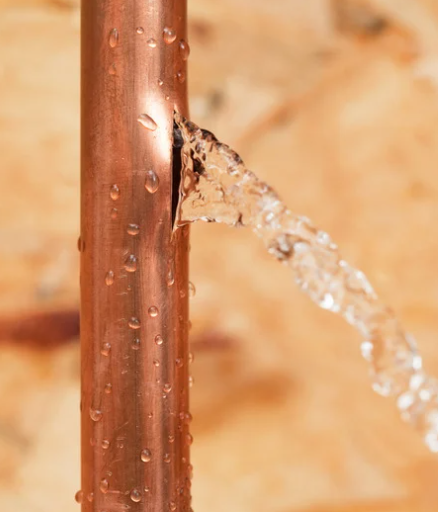 Water heater leaking onto concrete floor.