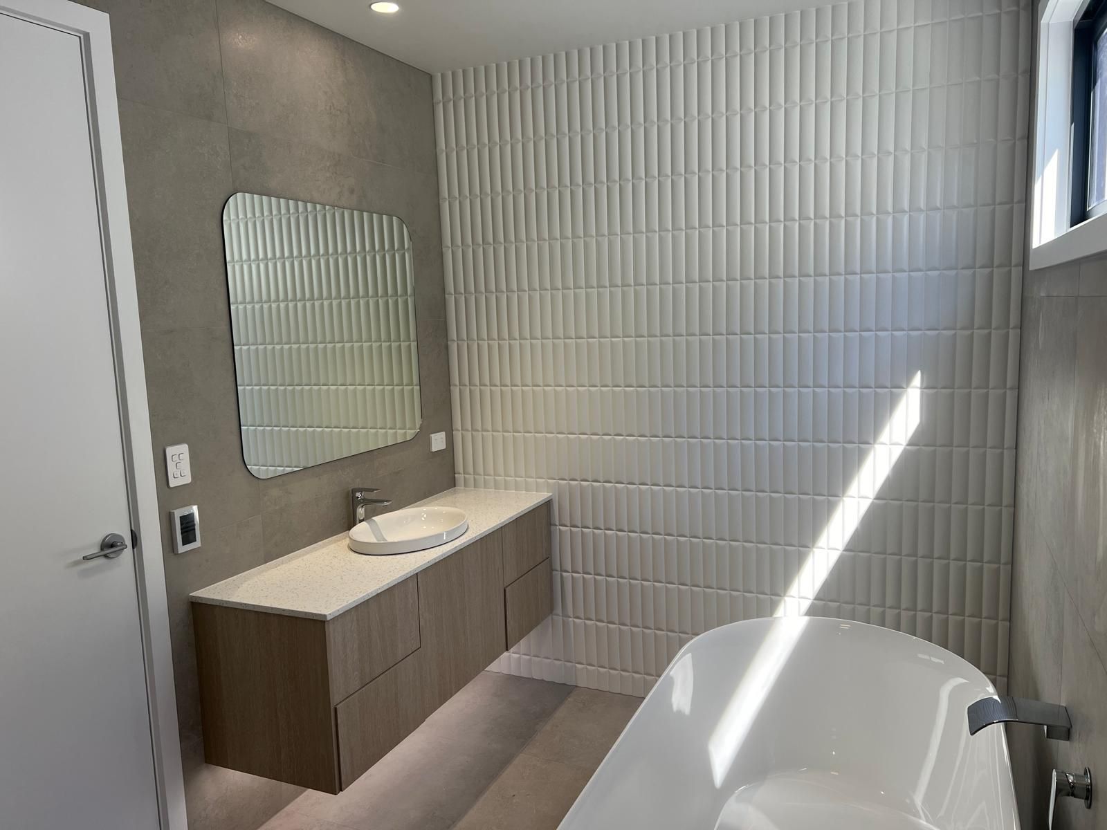 A Bathroom with A Bathtub , Sink , Mirror — Reflect Glass In Tuggerah, NSW
