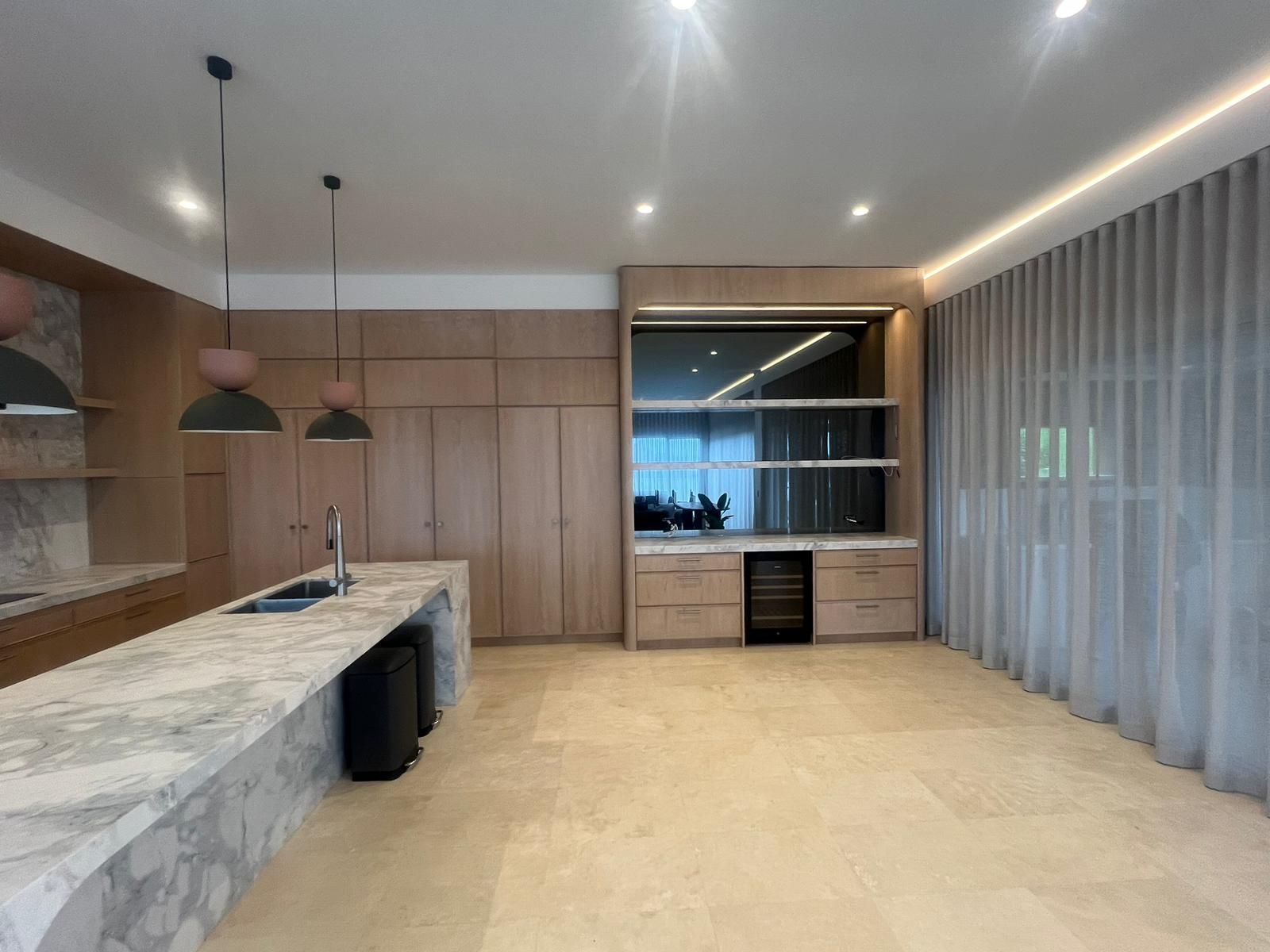 A Kitchen with A Marble Counter Top and Wooden Cabinets — Reflect Glass In Tuggerah, NSW