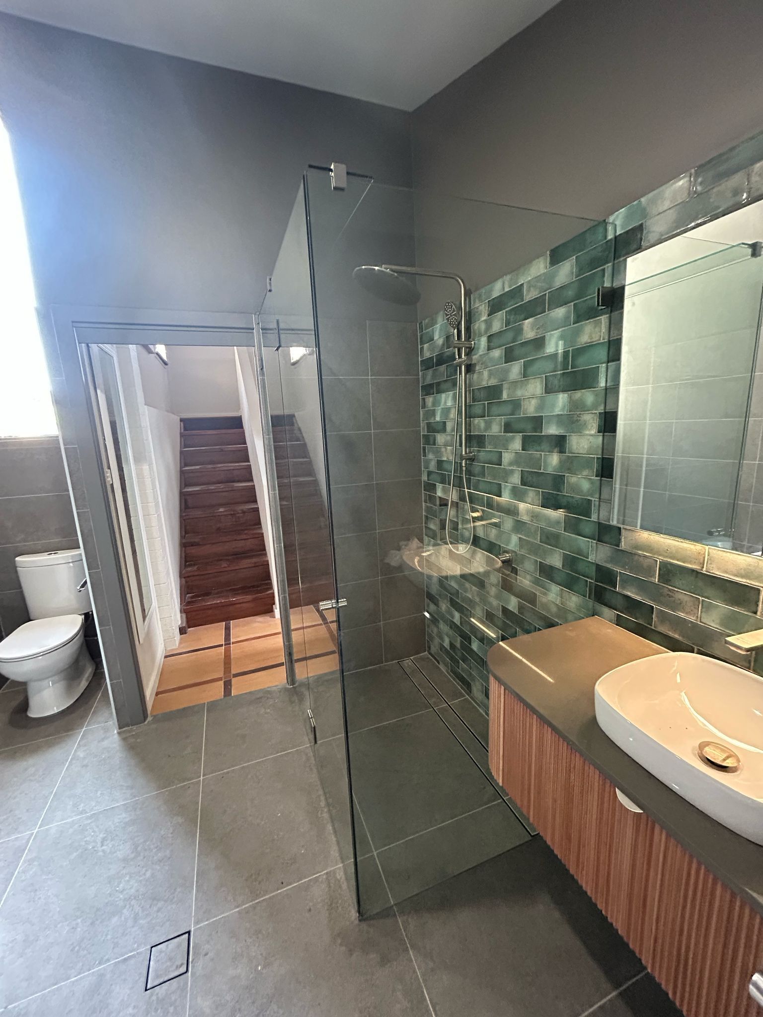 A Bathroom with A Walk in Shower, Sink, Toilet and Stairs — Reflect Glass In Tuggerah, NSW