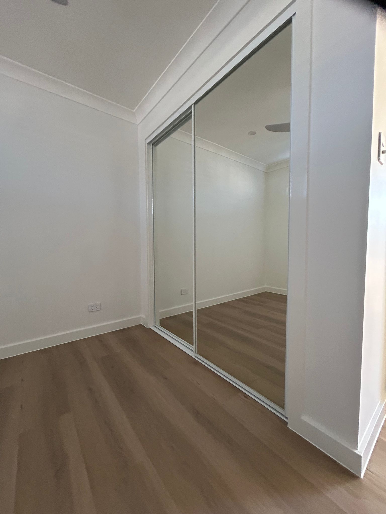 A Large Mirror in The Corner of The Room — Reflect Glass In Tuggerah, NSW