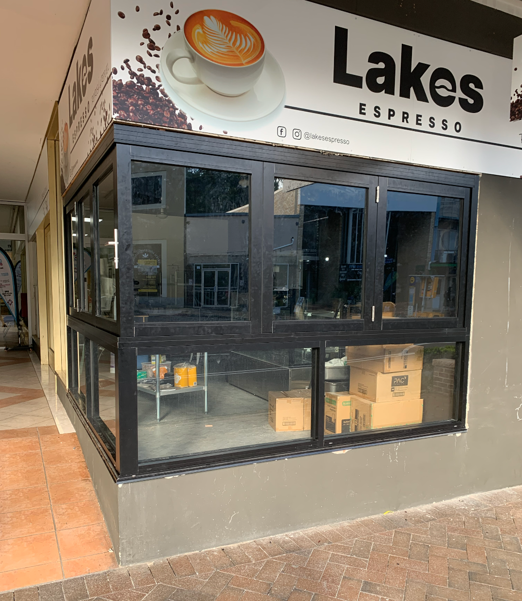A Coffee Shop with A Sign that Says Lakes Espresso — Reflect Glass In Tuggerah, NSW