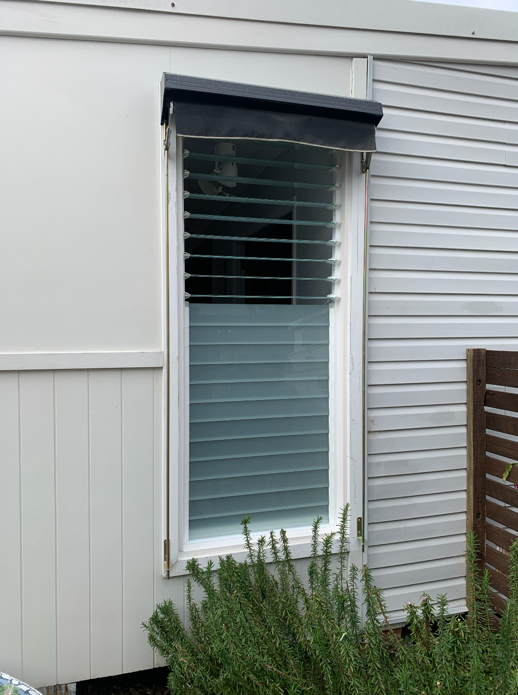A White House with A Window with Blinds on It — Reflect Glass In Tuggerah, NSW