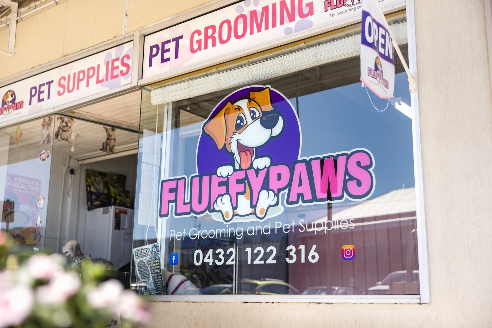 A Fluffy Paws Pet Grooming Shop With a Dog on the Window — Fluffy Paws Pet Grooming In Diamond Beach, NSW