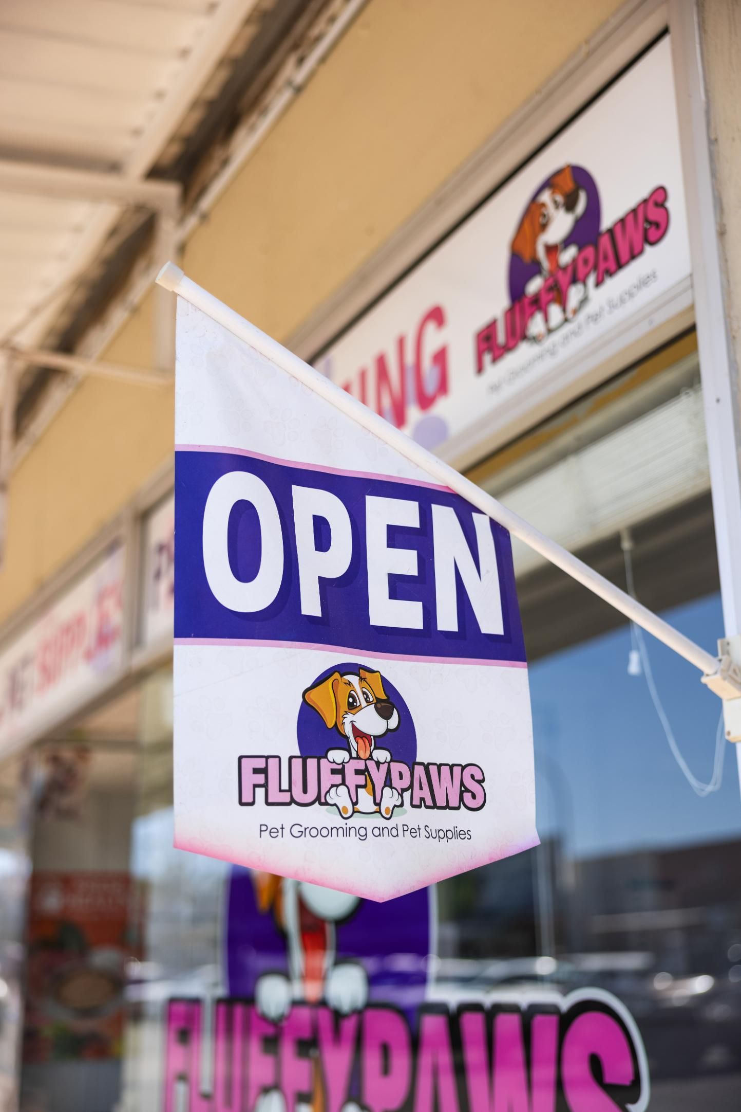 A Flag With the Word Open on It — Fluffy Paws Pet Grooming In Wingham, NSW