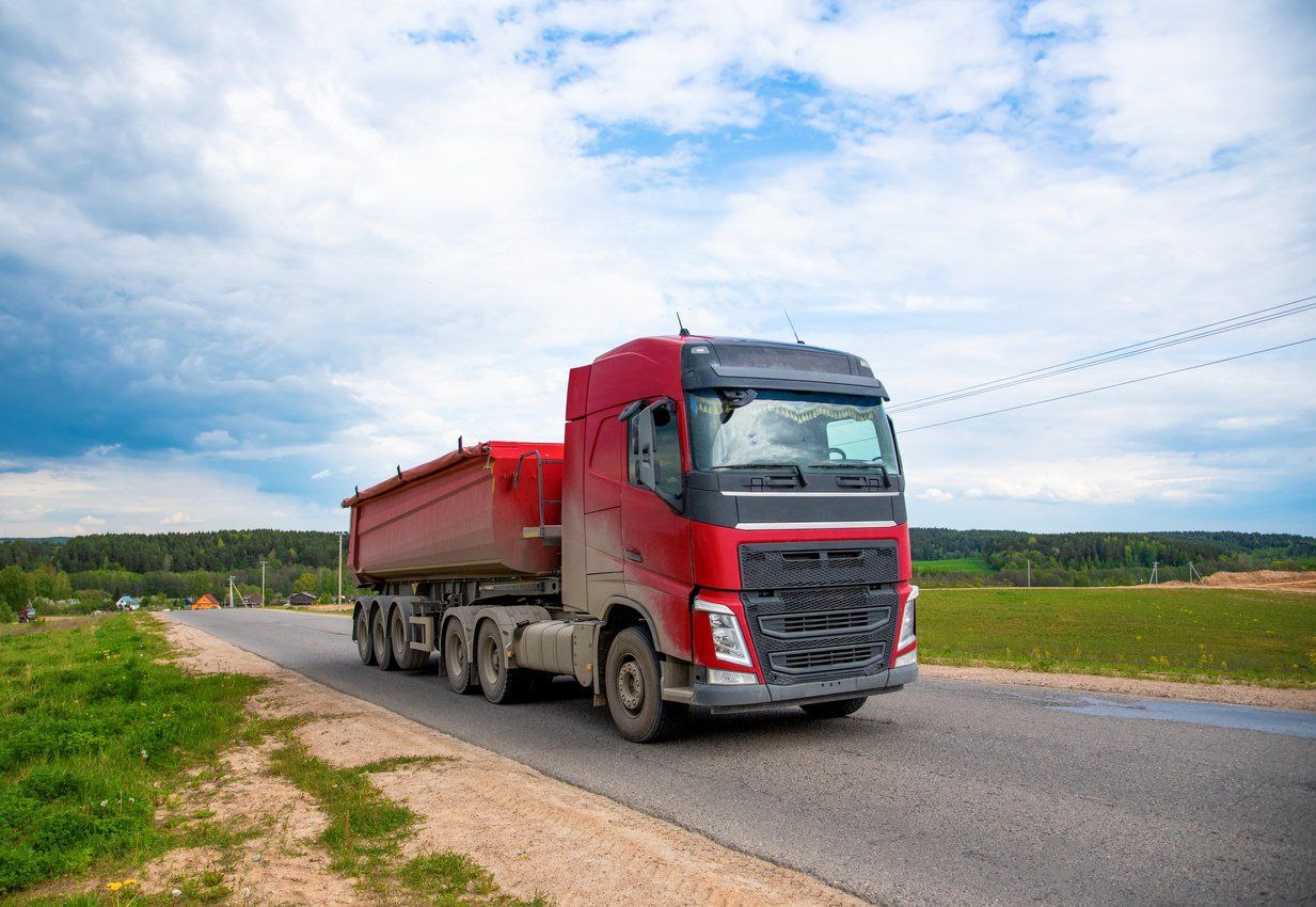 Red truck hauling materials