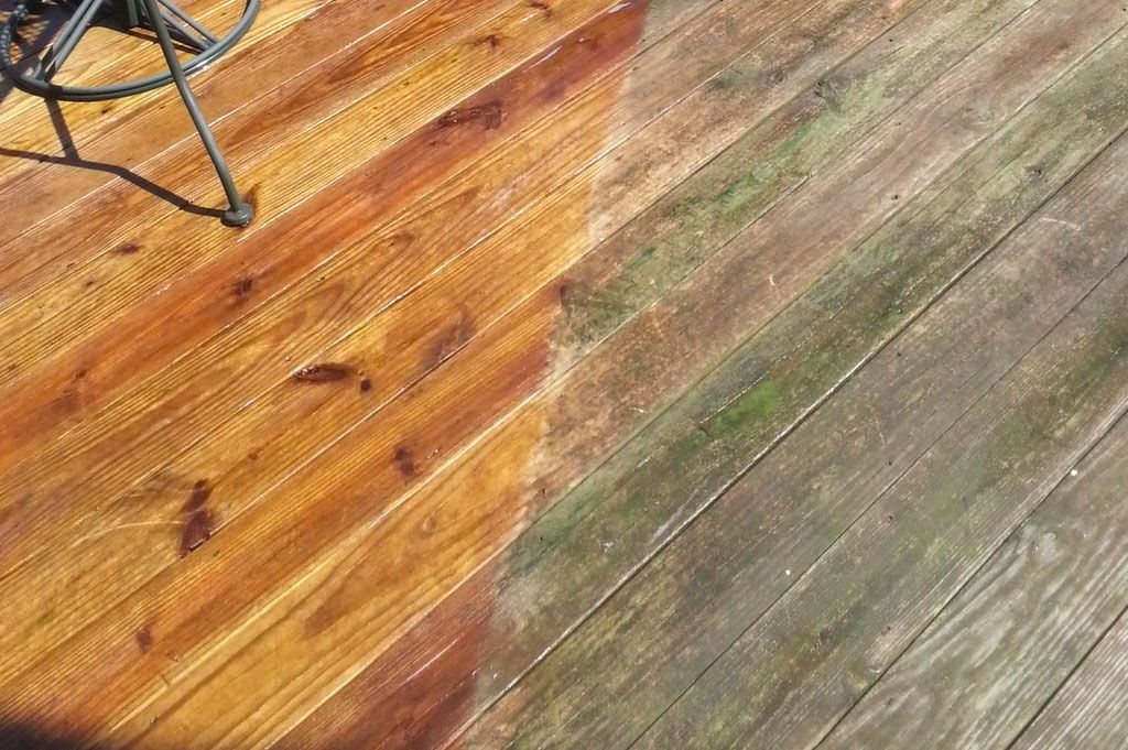 before vs after of a surface clean on this wood deck. Showing the effectiveness of pressure washing.