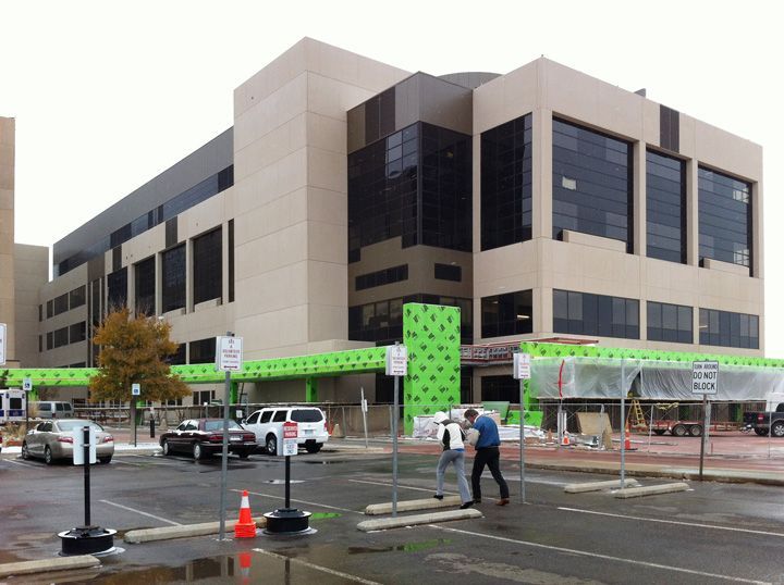 A large building with a lot of windows is being built