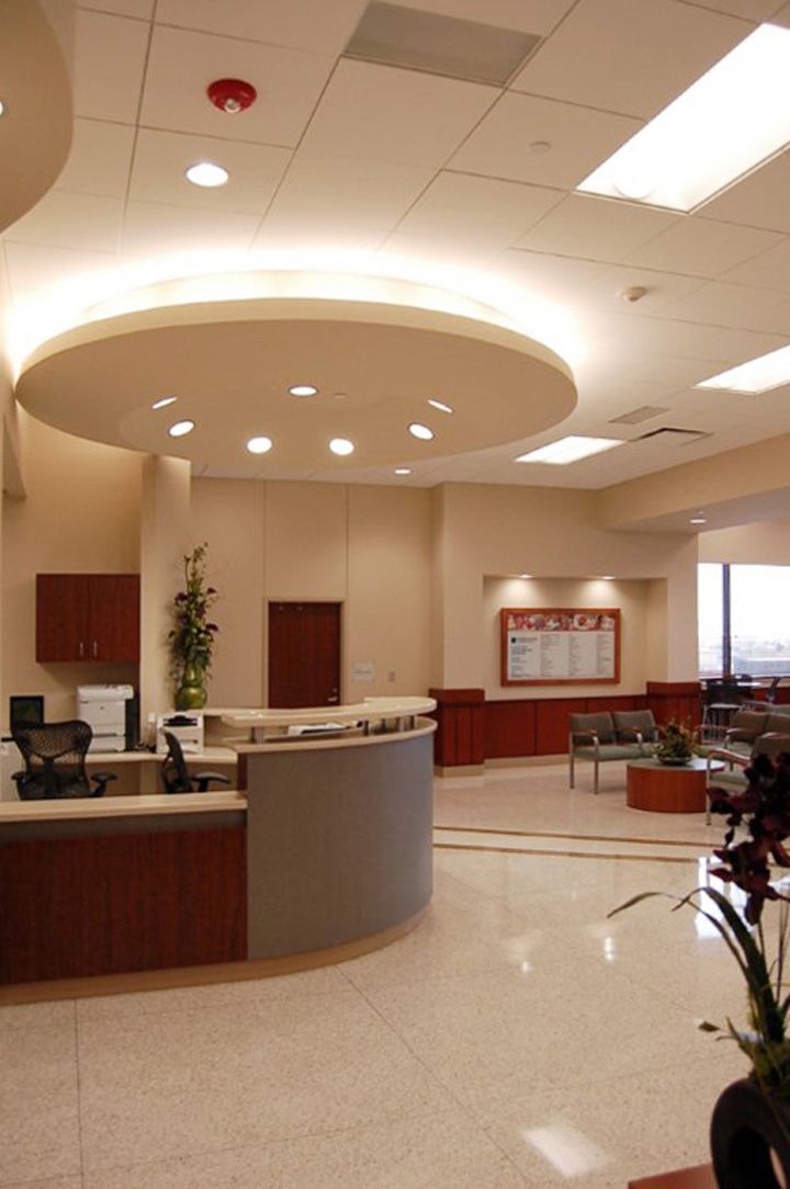 A reception area in a hospital with a circular ceiling