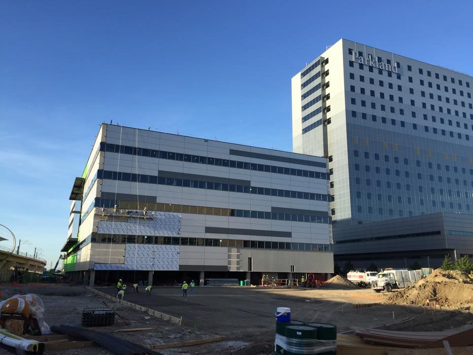 A large building with a lot of windows is being built.