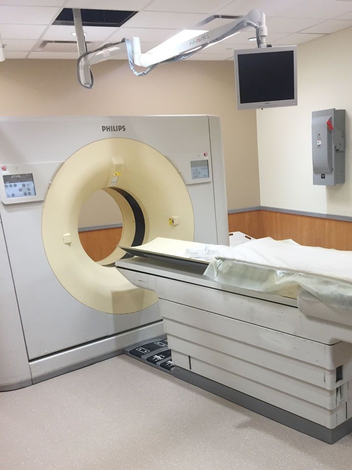 A hospital room with a large ct scan machine