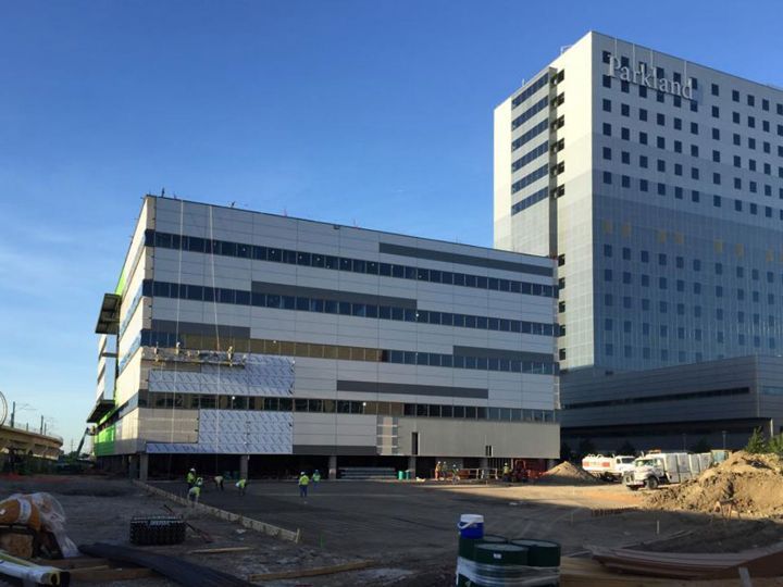 A large building with a lot of windows is being built