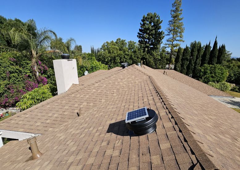 A roof with a solar panel on top of it
