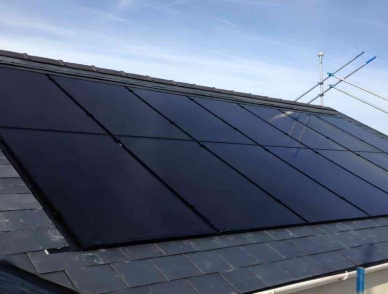 A roof with a lot of solar panels on it