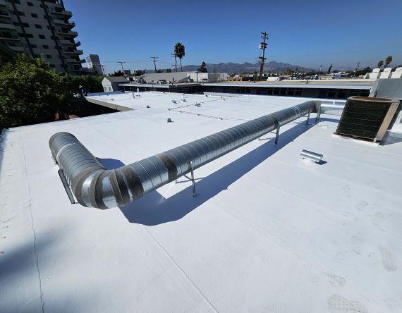 A white roof with a pipe on it