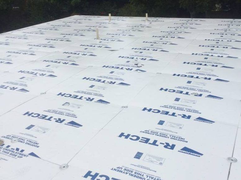 A roof with a lot of r-tech sheets on it