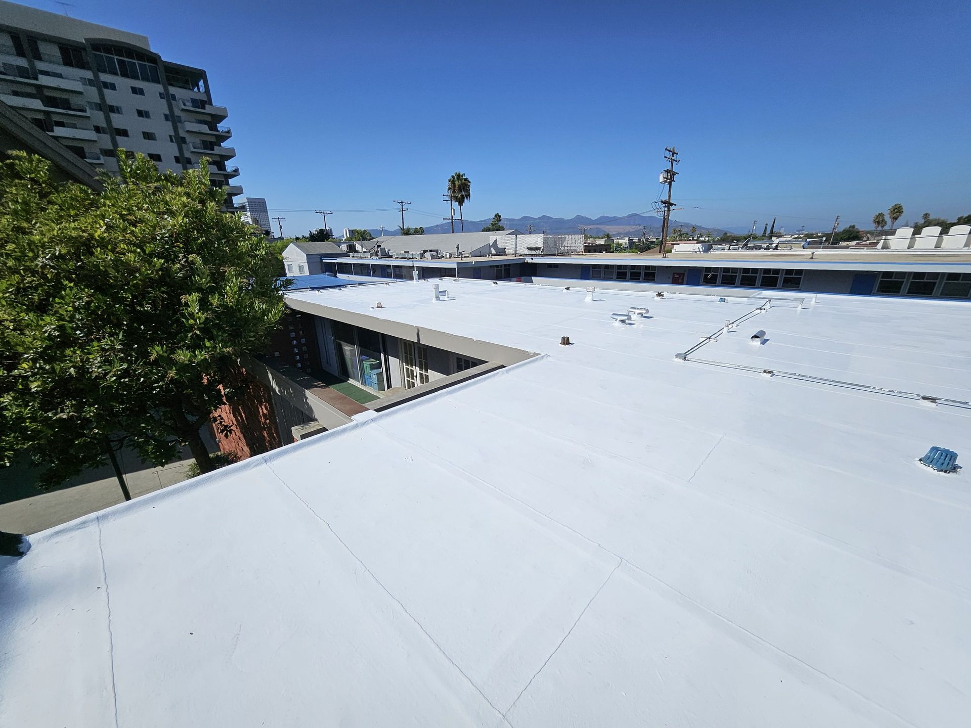 A white roof with a blue sky in the background