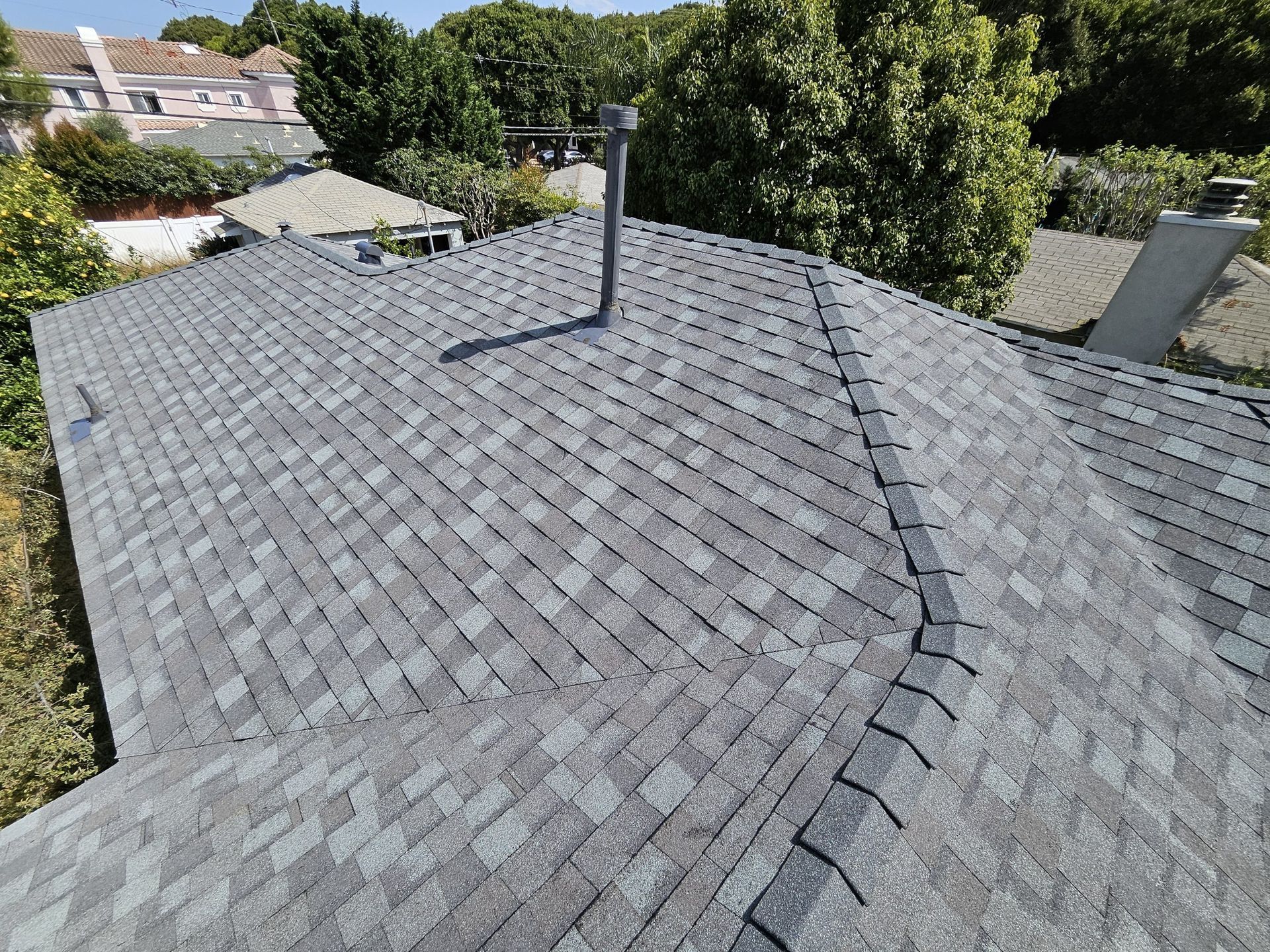 The roof of a house with a chimney on it