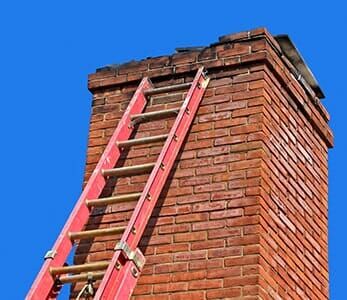Chimney with Ladder — Brown's Chimney Service in Bend, OR
