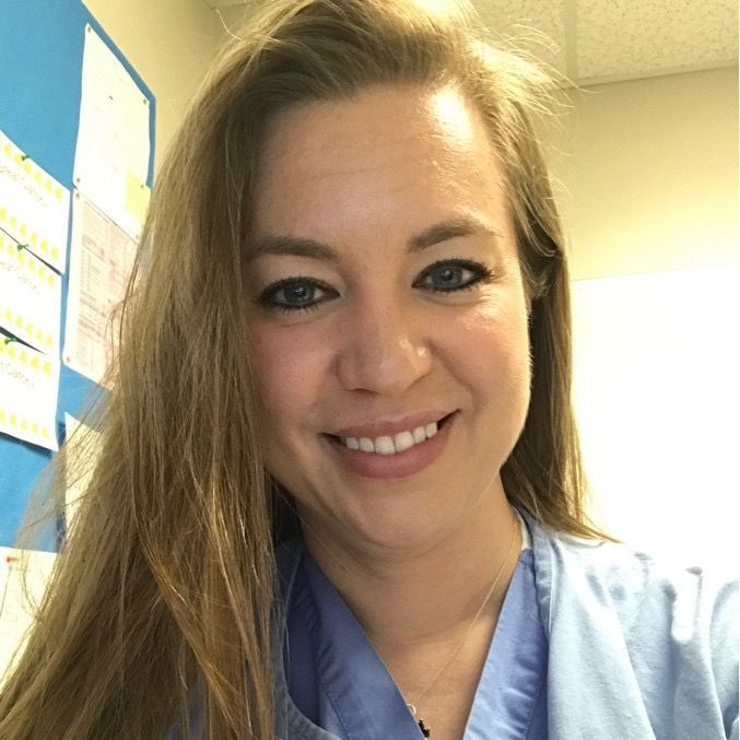 A woman is standing in front of a sign that says america tri billiards