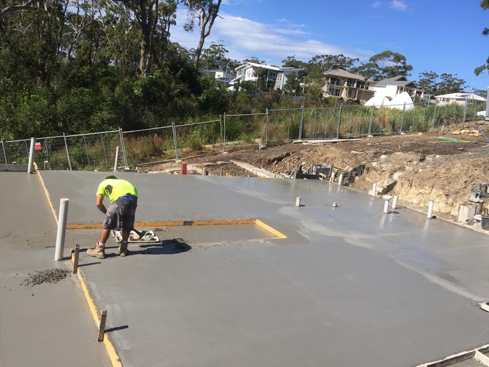 Worker Smoothing Concrete Slab — AJ's Concreting Services in Taylors Beach, NSW