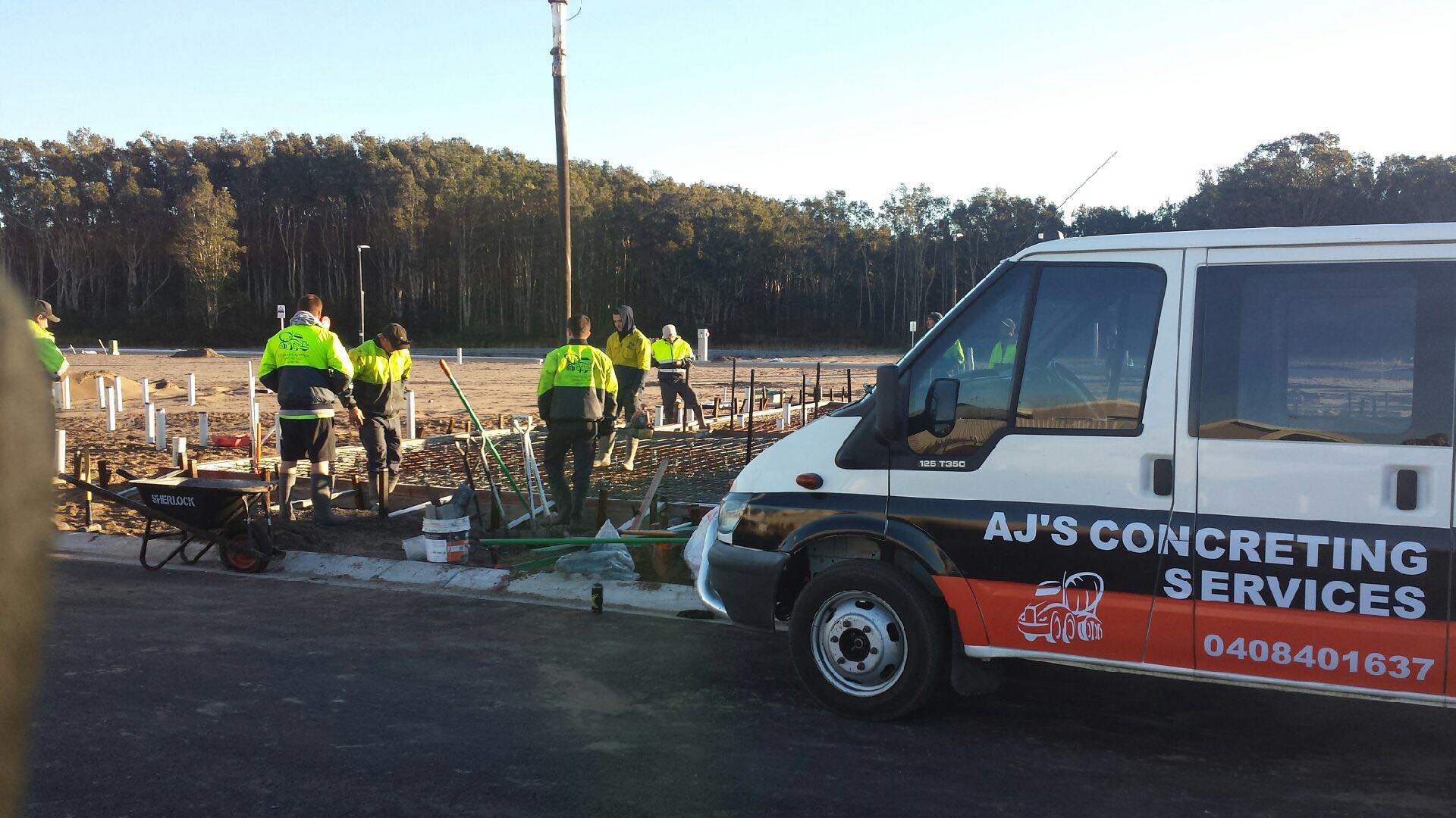 Construction Workers Pouring Concrete for Slab — AJ's Concreting Services in Taylors Beach, NSW