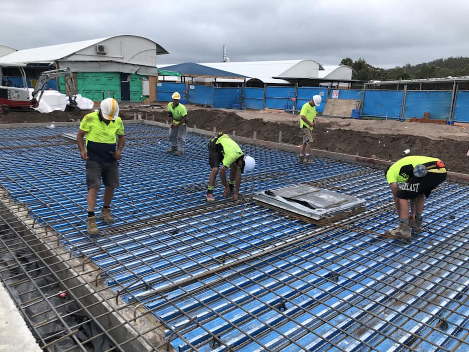 Construction Workers Laying Concrete — AJ's Concreting Services in Taylors Beach, NSW