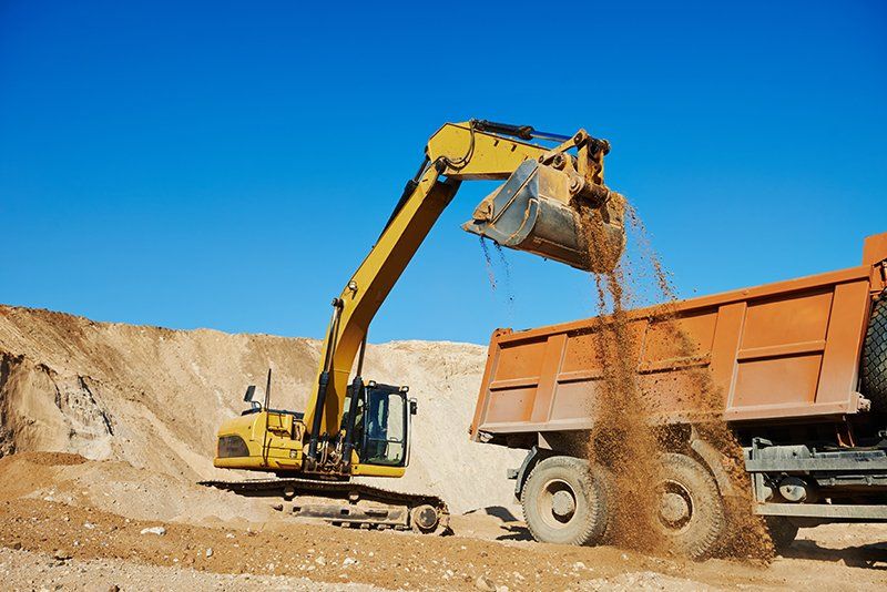 Excavator and Tipper Truck — AJ's Concreting Services in Taylors Beach, NSW