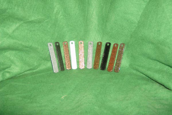 A row of sticks sitting on top of a green cloth.