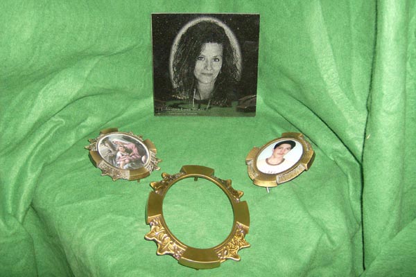 Three picture frames with a picture of a woman on a green cloth