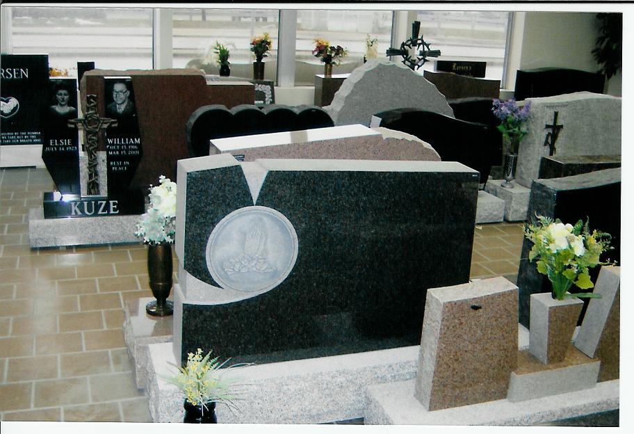 A display of gravestones with one that says kuze on it