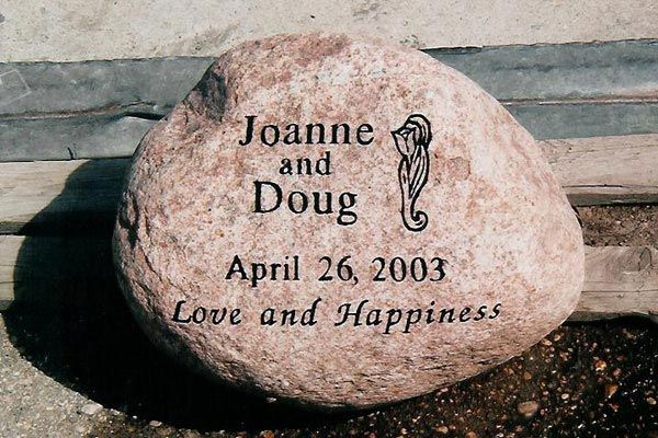 A rock that says joanne and doug april 26 2003 love and happiness