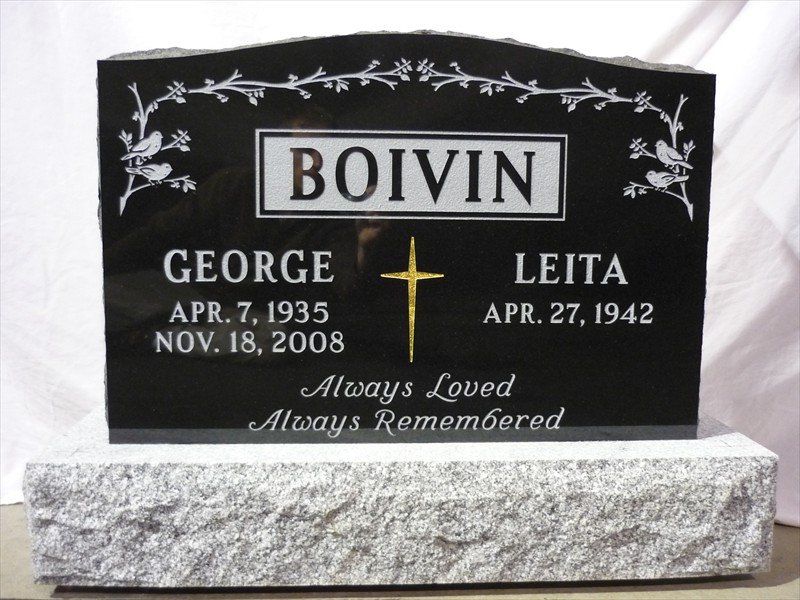 A black gravestone with the name boivin on it