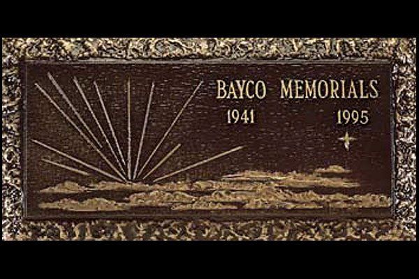A bronze plaque with the words bayco memorials on it